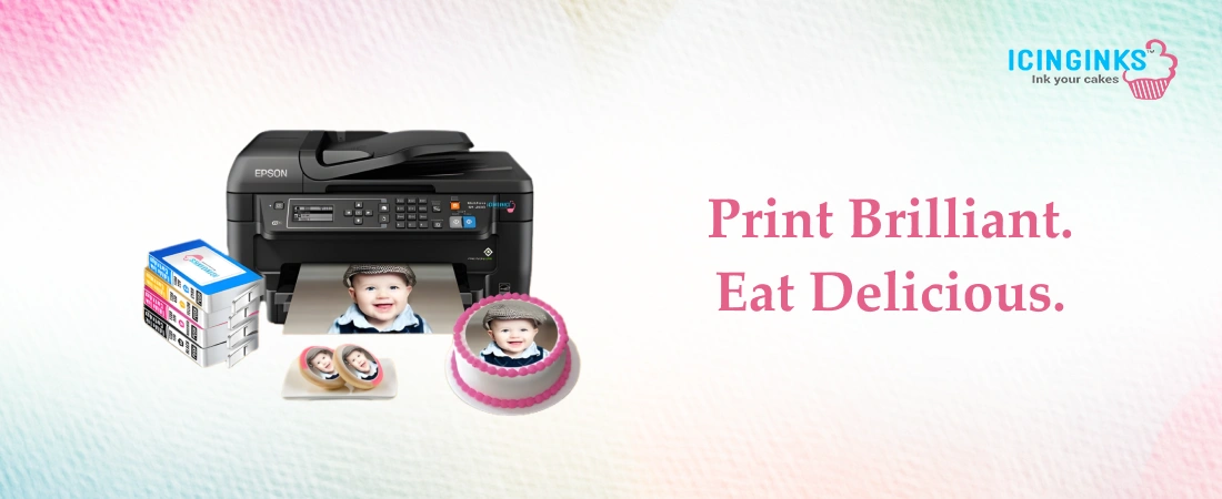 Icinginks edible ink cartridges and refill bottles displayed alongside printed frosting sheets with vibrant cake designs 